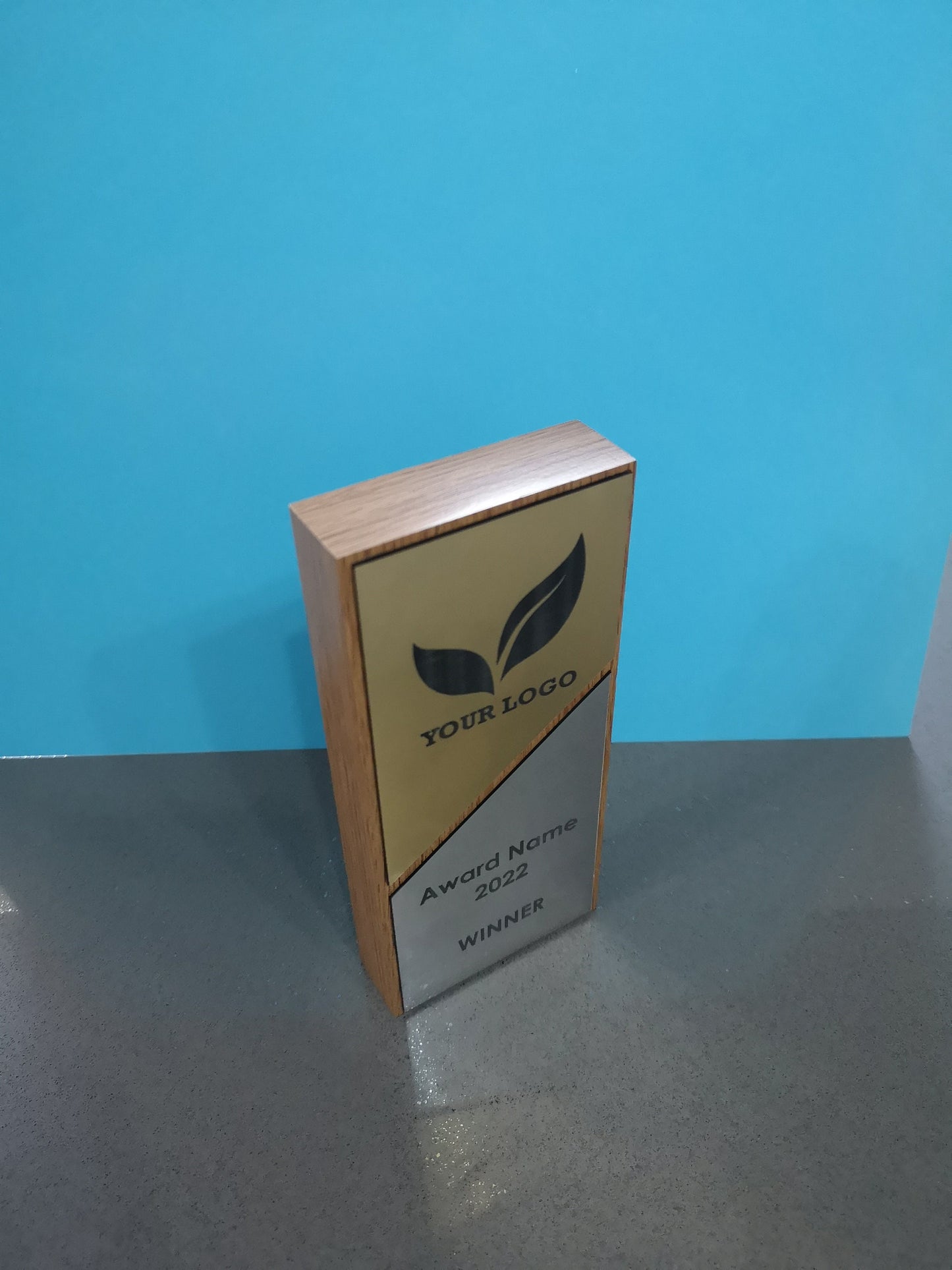 Light Oak Wooden Award with a Combination of Silver and Gold Engraving Area