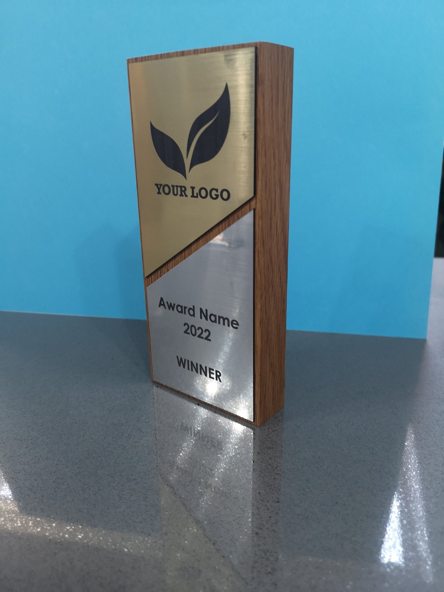 Light Oak Wooden Award with a Combination of Silver and Gold Engraving Area