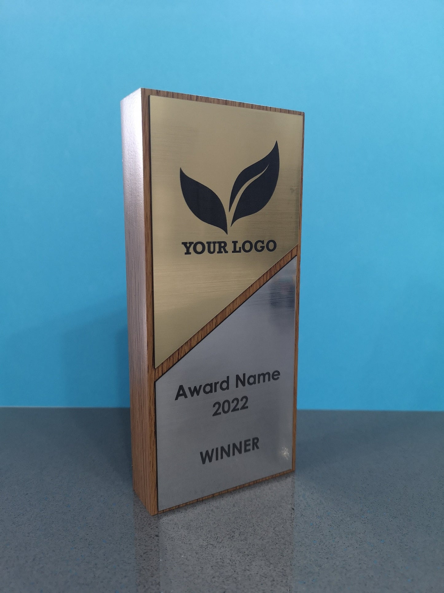 Light Oak Wooden Award with a Combination of Silver and Gold Engraving Area